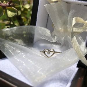 Heart shaped ring w/ little diamond in the center!